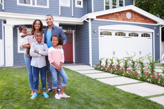 picture of Black family in front of home