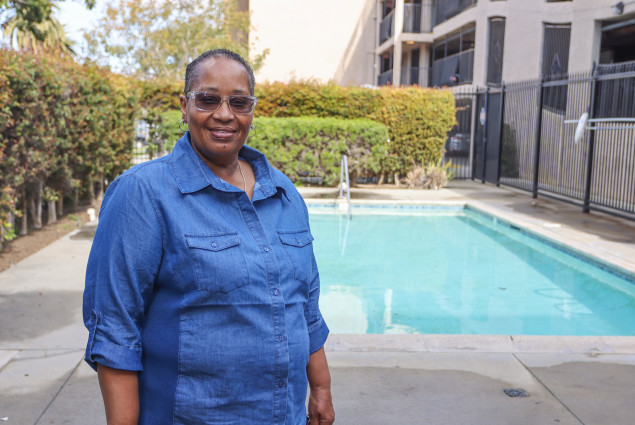 Photo of Doris Ealy with pool in the background.